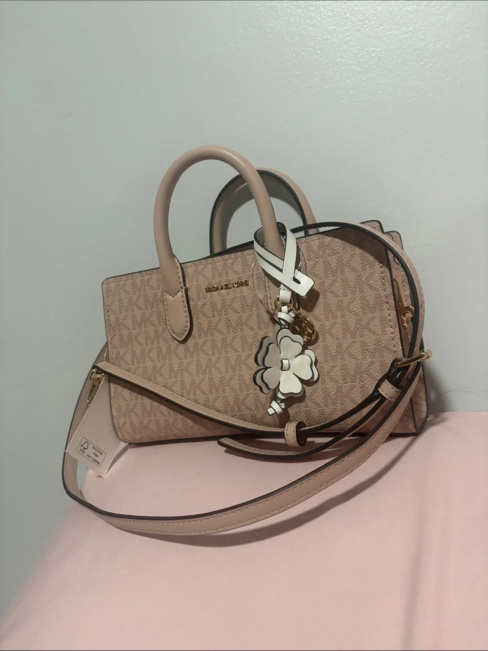 A cute MICHAEL KORS Blush Pink Logo Satchel with Floral Charm